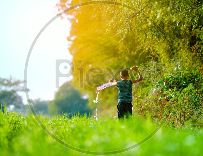 Indian Boy Playing With Kite in Rural India