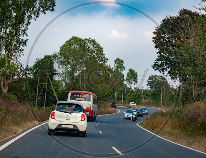 Vehicles on Curve Road of Hassan district, Karnataka.