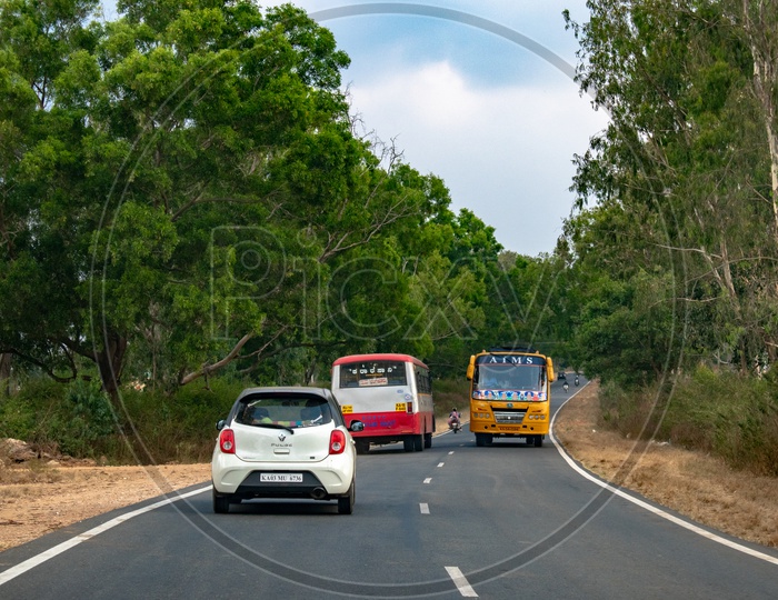 Vehicles on curve roads of Hassan district, Karnataka.