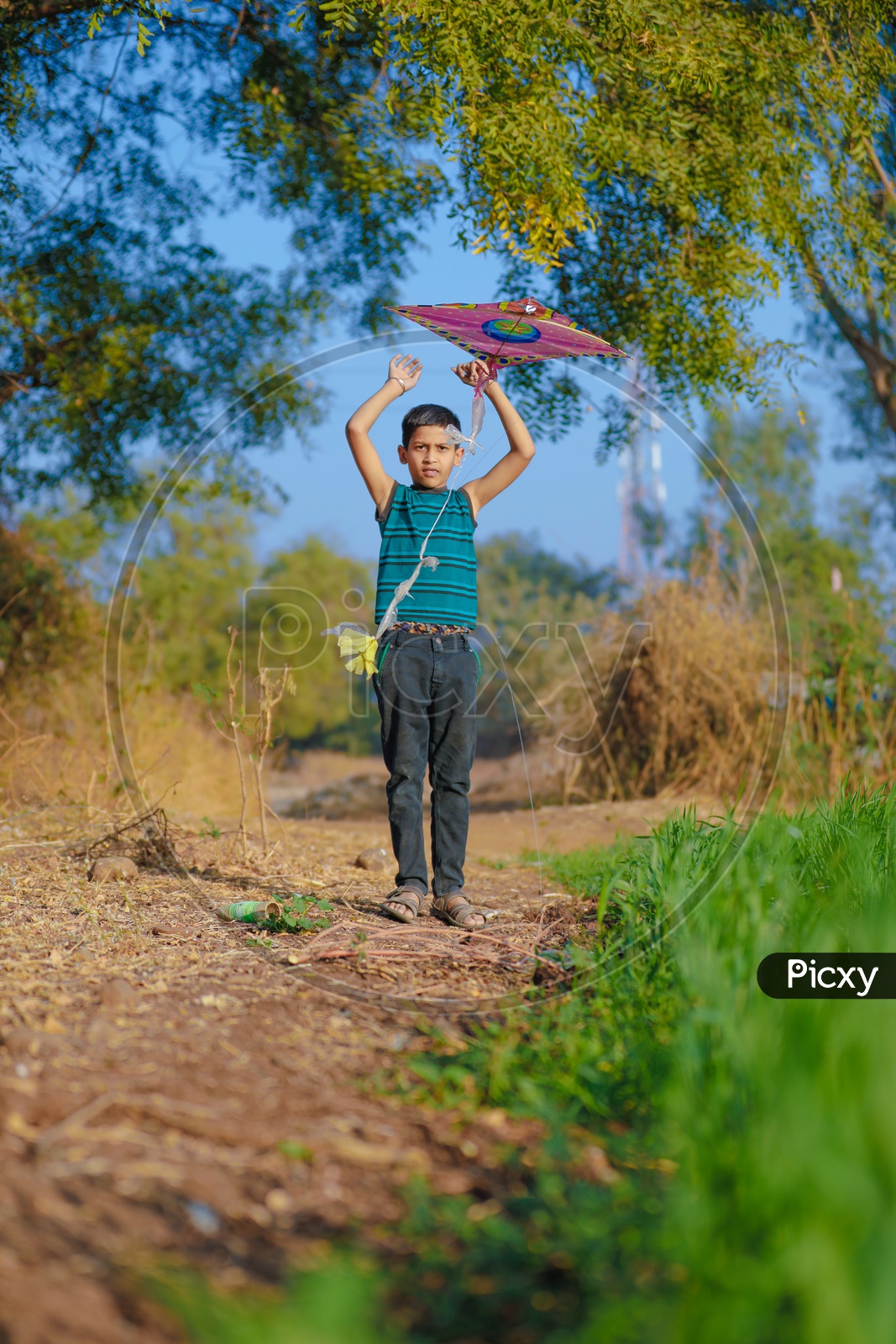 Indian Rural Boy Playing With Kite