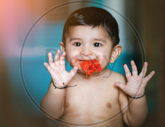 Indian baby Boy With Smiling Face Closeup Shot eating watermelon fruit