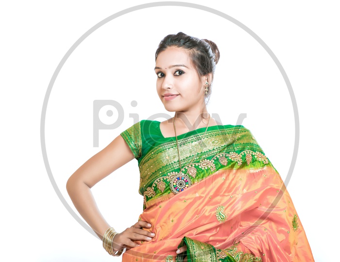 Indian Young Lady Wearing Saree  with a Smiling Face on an Isolated White Background