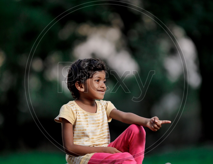 Indian Girl Child Playing Cricket