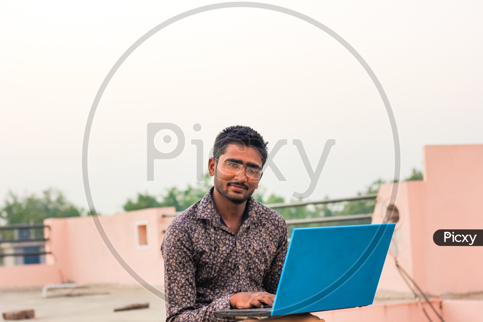 Indian Young Man With Laptop