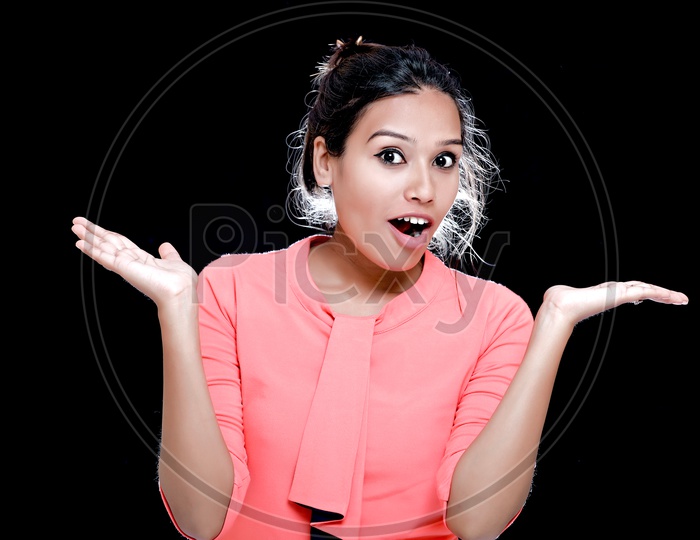 Indian Young Girl With Cute Expressions on an Isolated Black  Background