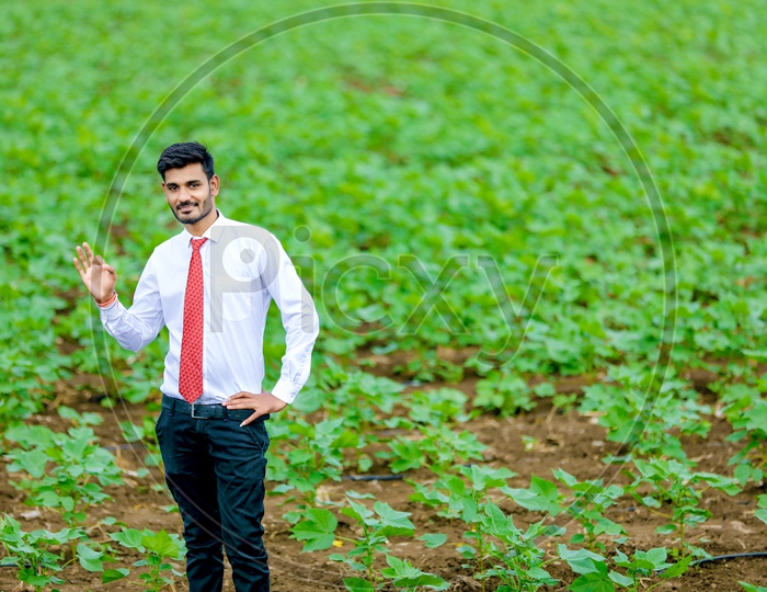 Indian Young Boy in Formal Attire in Agricultural Fields With Expression