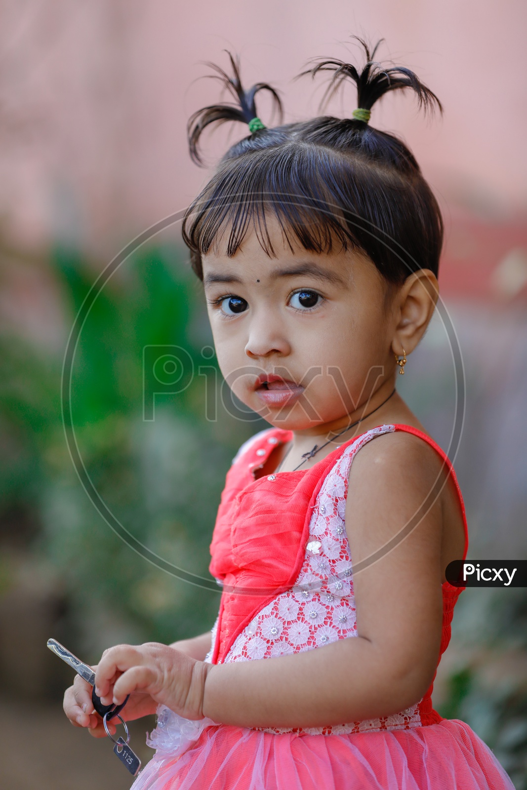 Indian Cute Girl Child Wearing Frock Closeup Shot with an Expression On Face