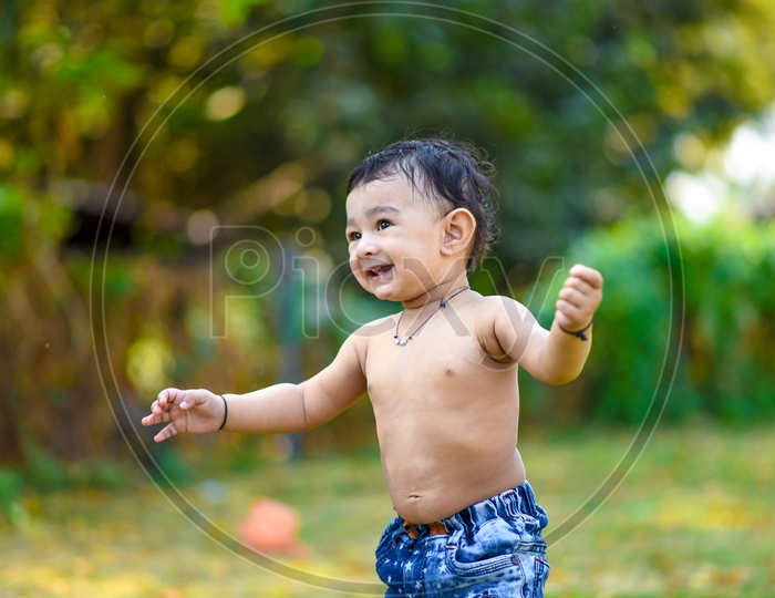 Indian Cute Baby Boy Playing With a Smiling Face Closeup Shot