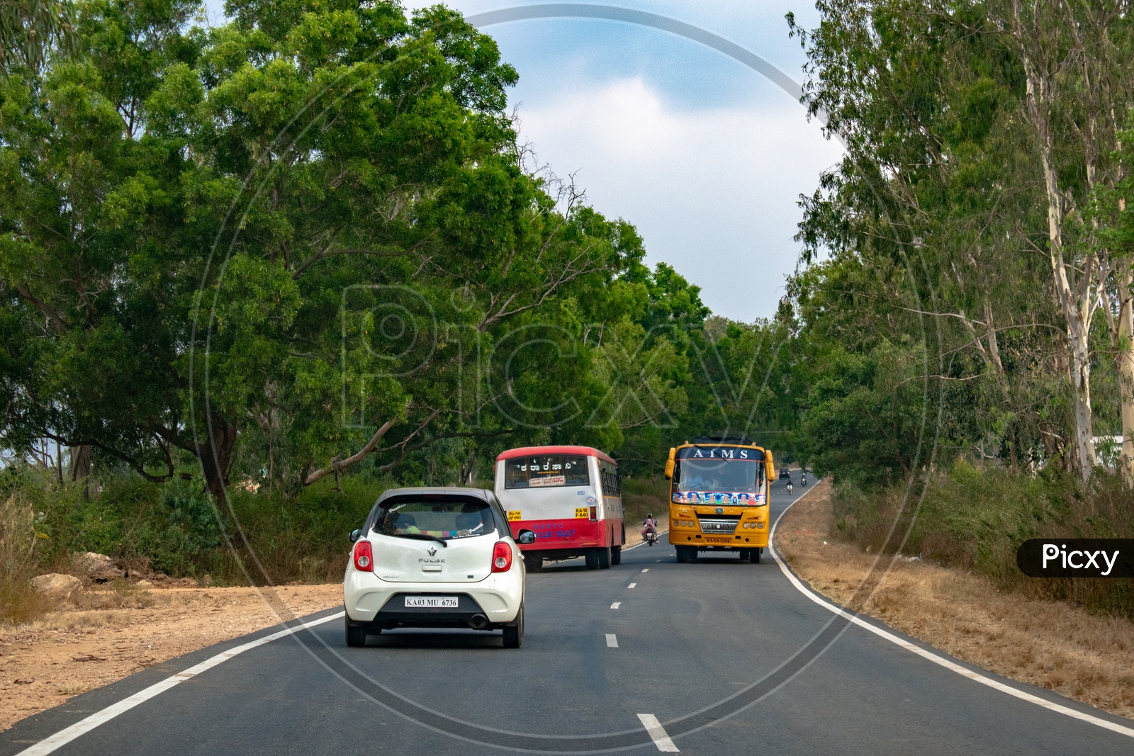 Vehicles on curve roads of Hassan district, Karnataka.