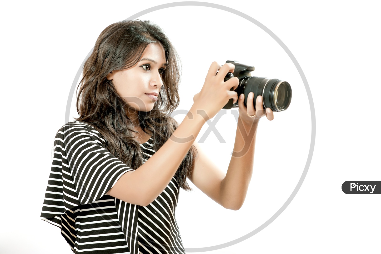 Indian girl take a photo with digital camera on white background