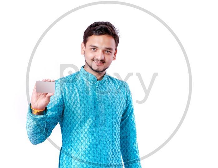 Indian Young Professional Man With a Smiling Face and Holding An Empty Card  On an Isolated White Background