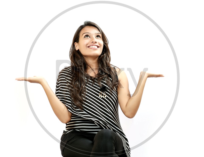 Indian Young Girl With an Expression On Her Face On an Isolated White Background