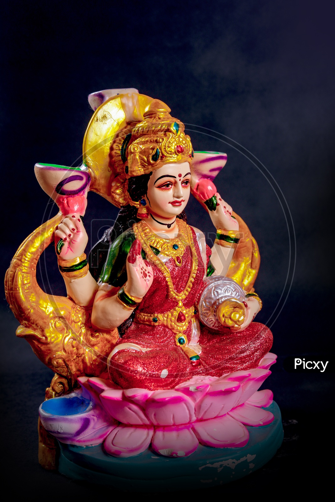sri lakshmi devi idol with black background