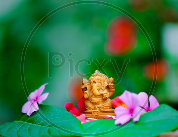 Ganesh Idol and beautiful greenery  in the background