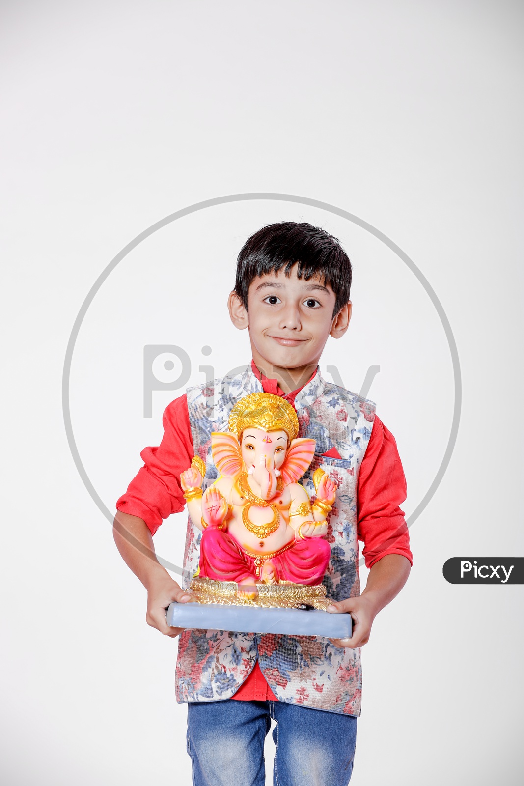 Indian Boy Child  with Lord Ganesh Idol