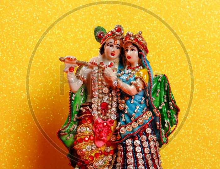 Radha Krishna Idol and beautiful yellow background / Lord Sri Krishna Idol