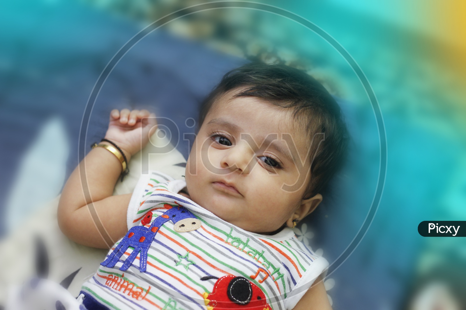 Indian Cute Baby Boy Lying on Bed With Cute Expressions and Looking To Camera