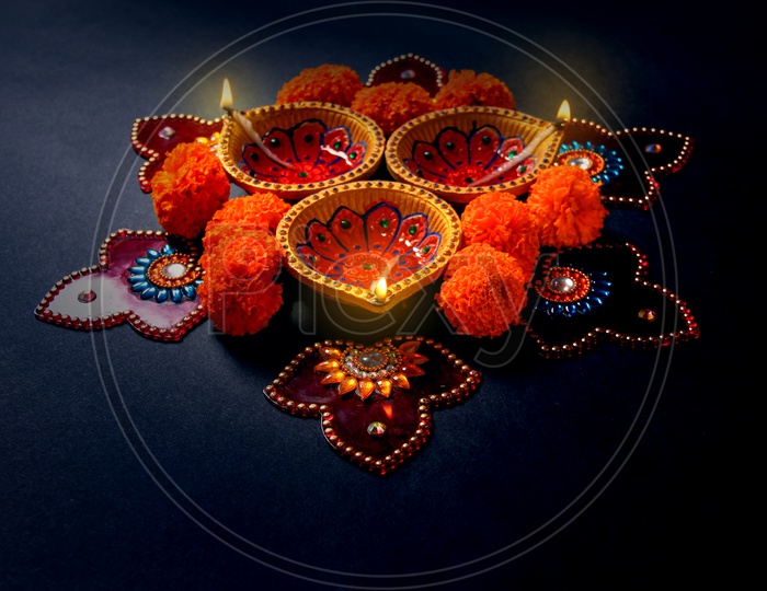 Diwali Indian Festival Diya or lamp with black background / Lightened Up Diya