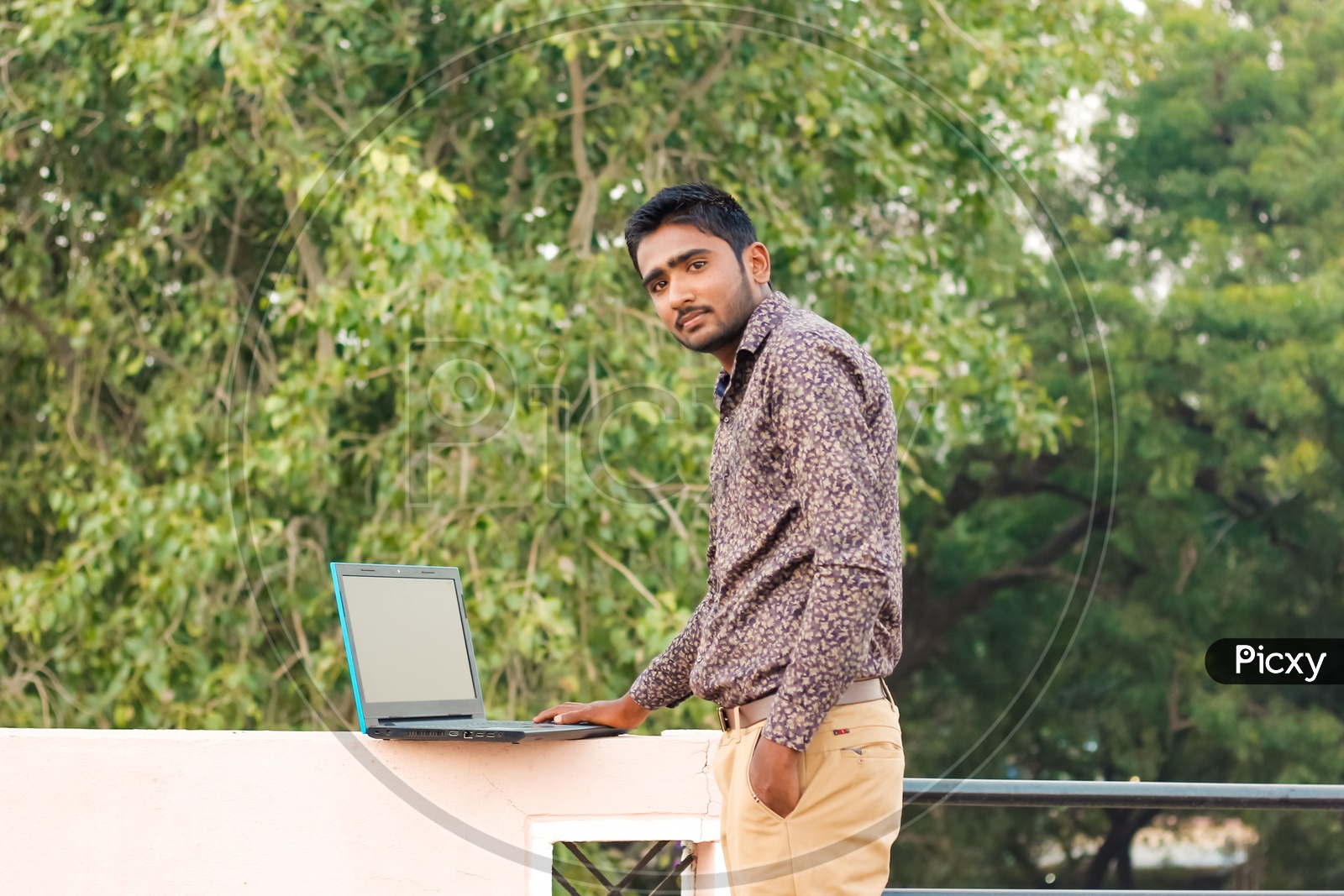 Indian Young Man With Laptop