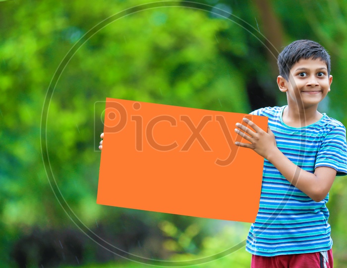 Indian Boy child Showing Placard with an Expression
