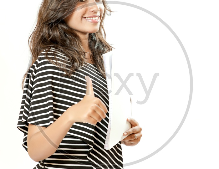 Indian Young College Girl With an Expression On Her Face and Showing Thumbsup  On an Isolated White Background