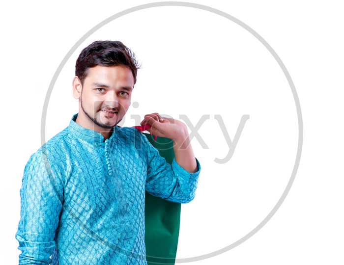 Indian Young Man With Shopping Bags And With a Smiling face on an isolated White Background