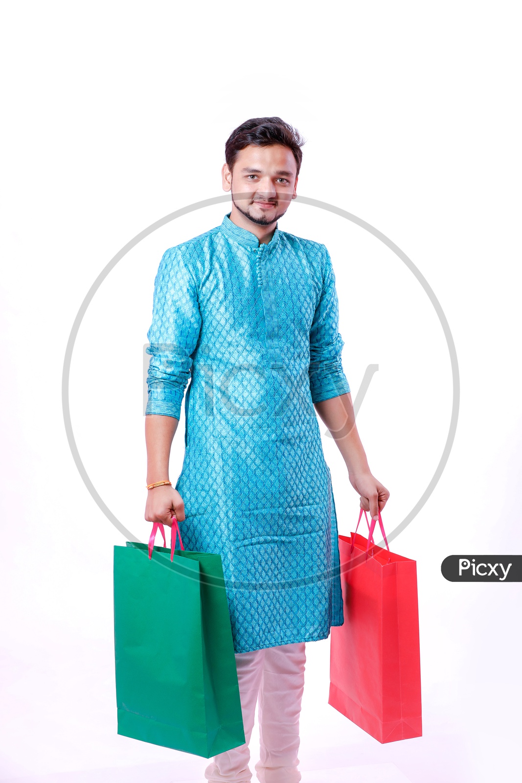 Portrait of a happy Indian Men carrying shopping bags  with white background