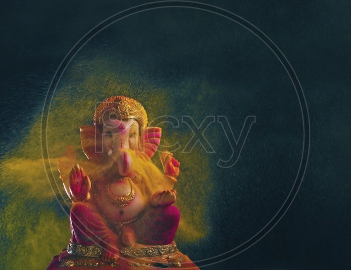 Ganesh Idol with beautiful colour splash in the background