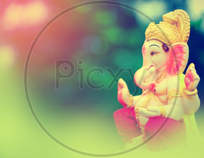 Lord Ganesh Idol with beautiful greenery in the  background
