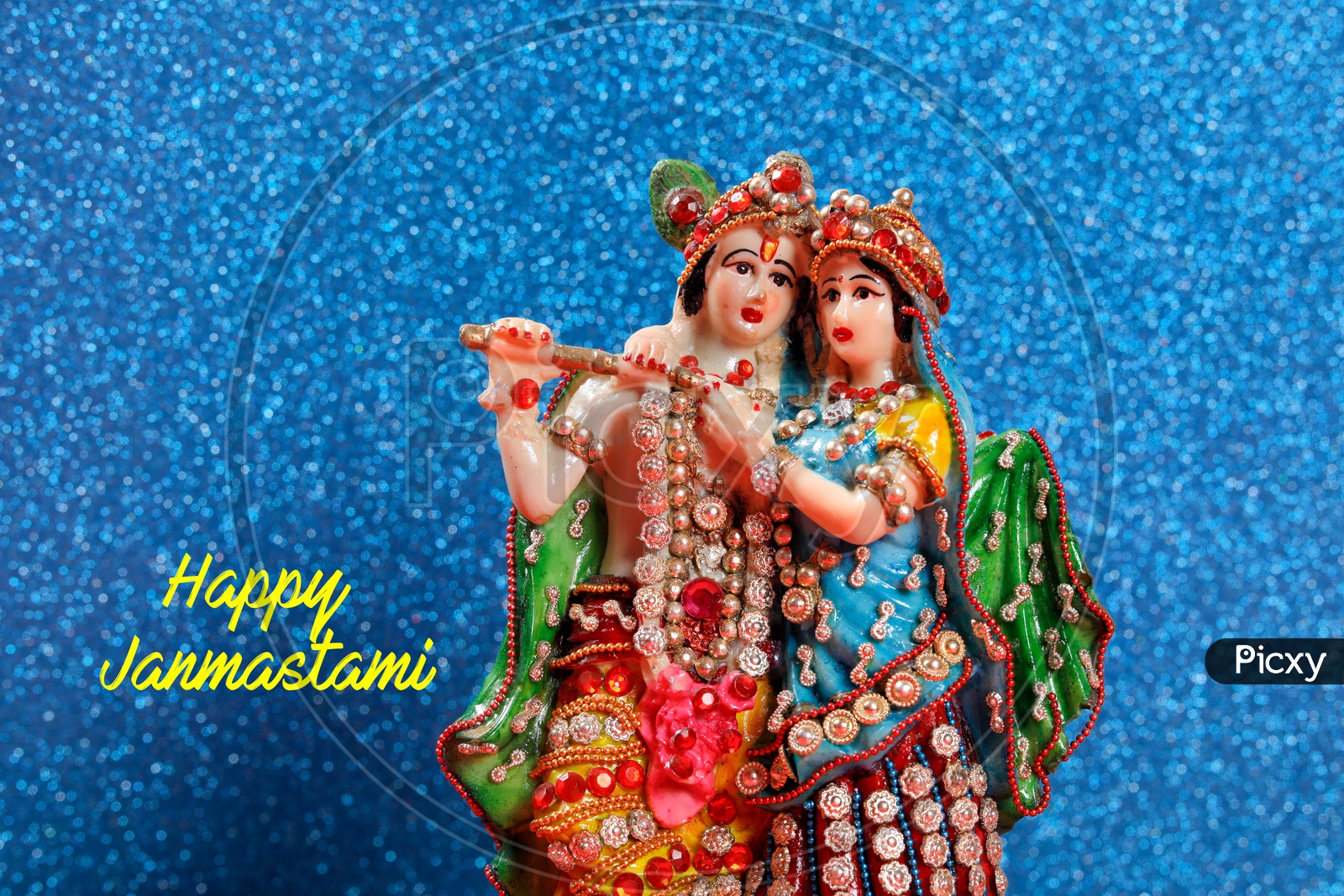 Happy Janmastami Poster with Radha Krishna Idol and beautiful blue background