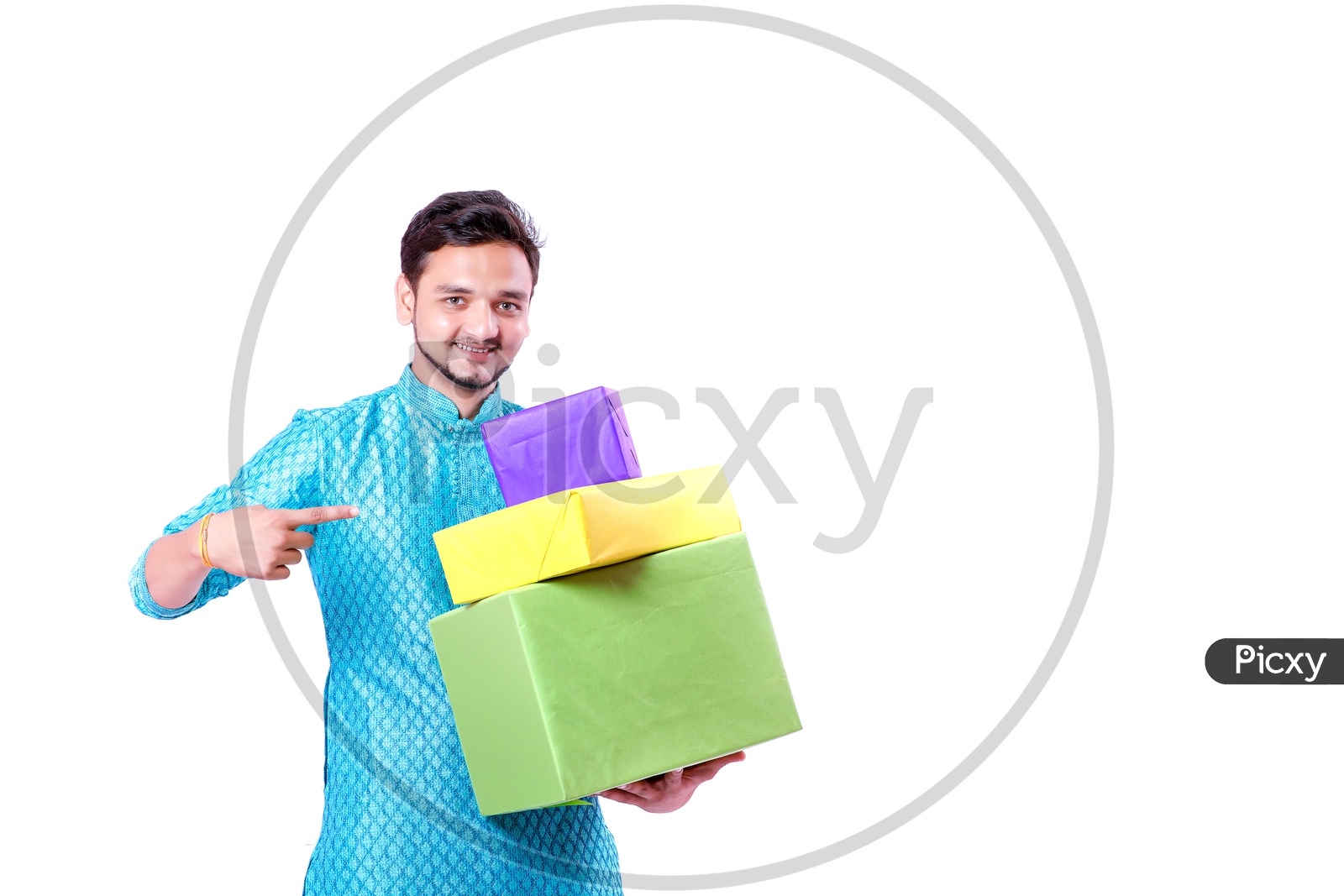 Portrait of a happy Indian Men pointing towards  gifts in hands  with white background
