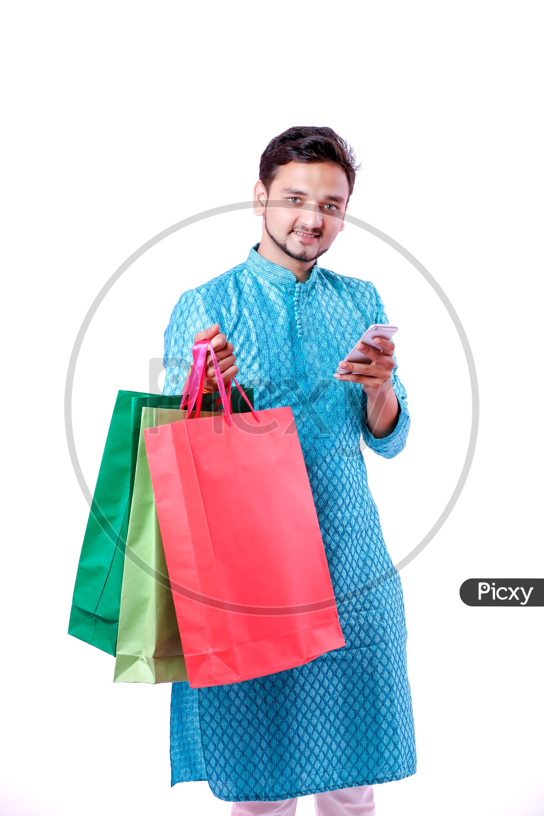 Indian Young Man With Shopping Bags And With Mobile on Hand on an isolated White Background