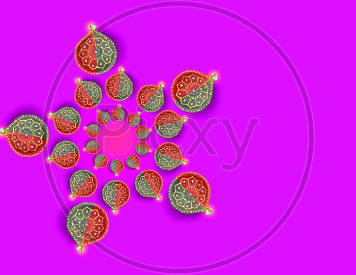 Diwali Indian Festival Diya or lamp with pink background