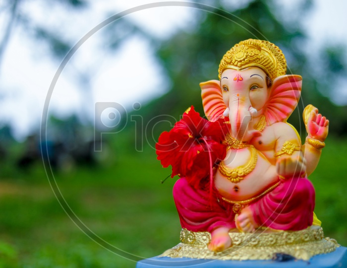 Ganesh Idol with beautiful greenery  in the background