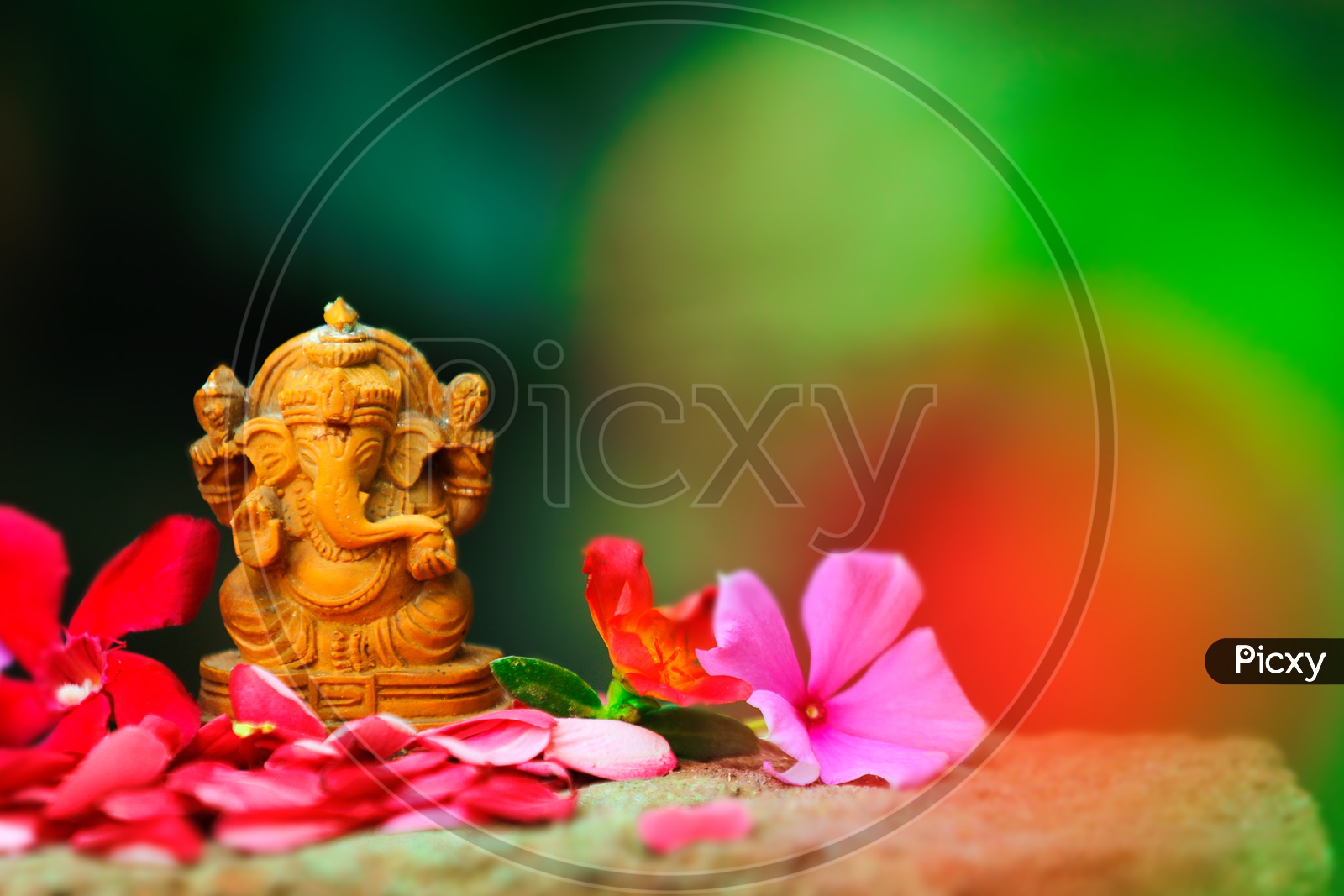 Ganesh Idol with  beautiful flowers in the foreground