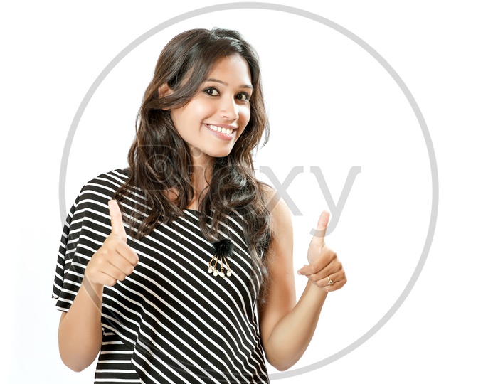 Indian Young Girl With an Expression On Her Face and Showing double  Thumbsup  On an Isolated White Background