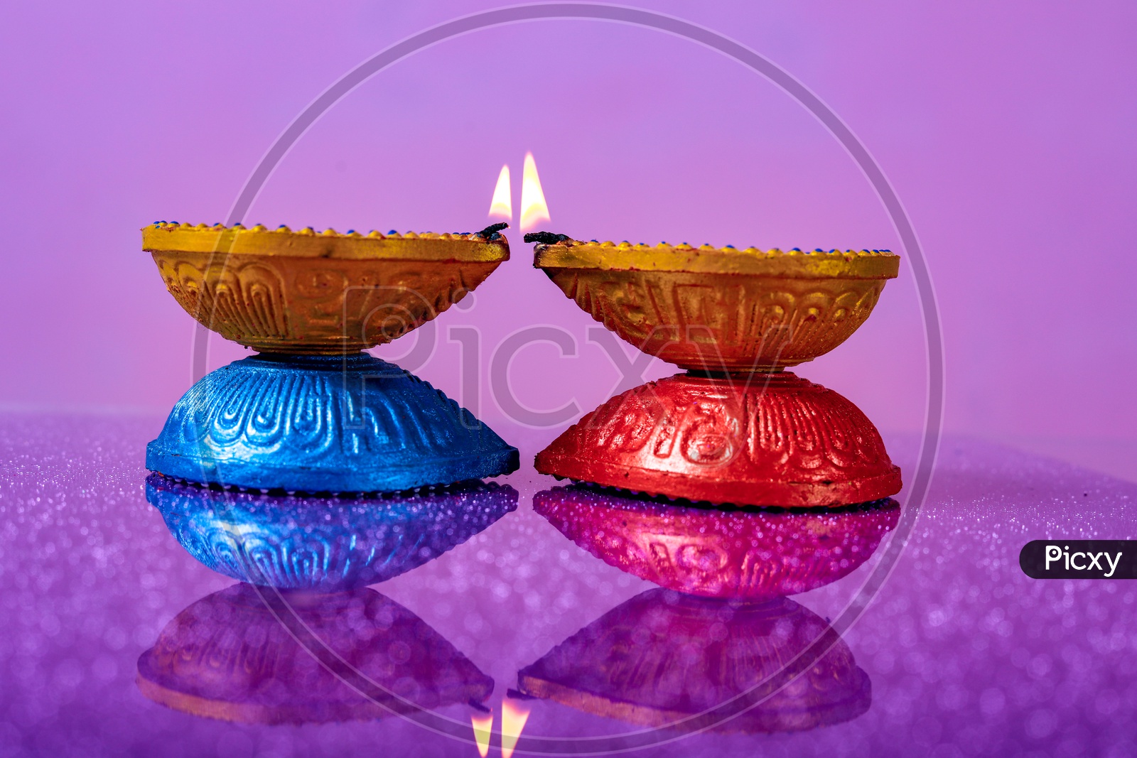 Diwali Indian Festival Diya or lamp with pink background / Lightened Up Diya / Diwali Festival of India