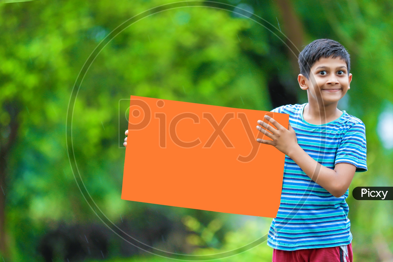 Indian Boy child Showing Placard with an Expression