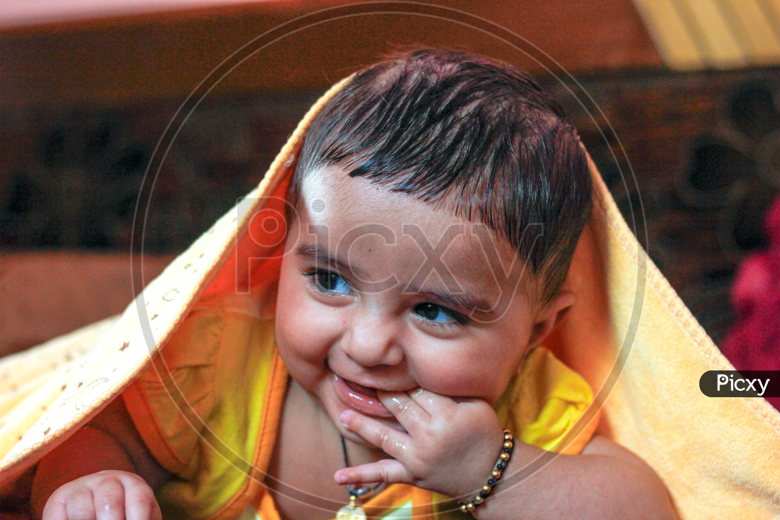 Indian Cute Baby Closeup Shots With Expressions Lying on a Bed in Home