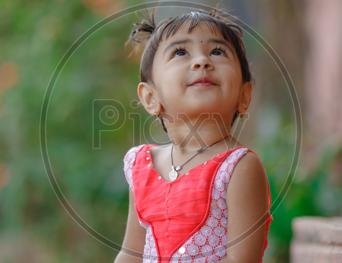 Indian Cute Girl Child In Frock Closeup Shot With Expressions