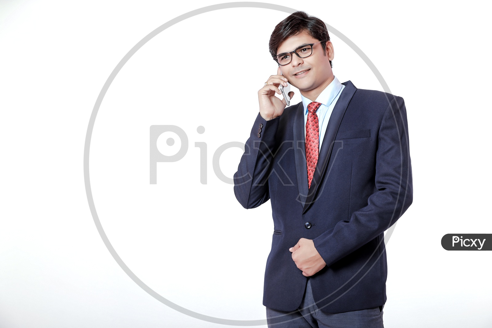 Indian Young Professional Man In Suite  Talking In Phone And Smile On Face