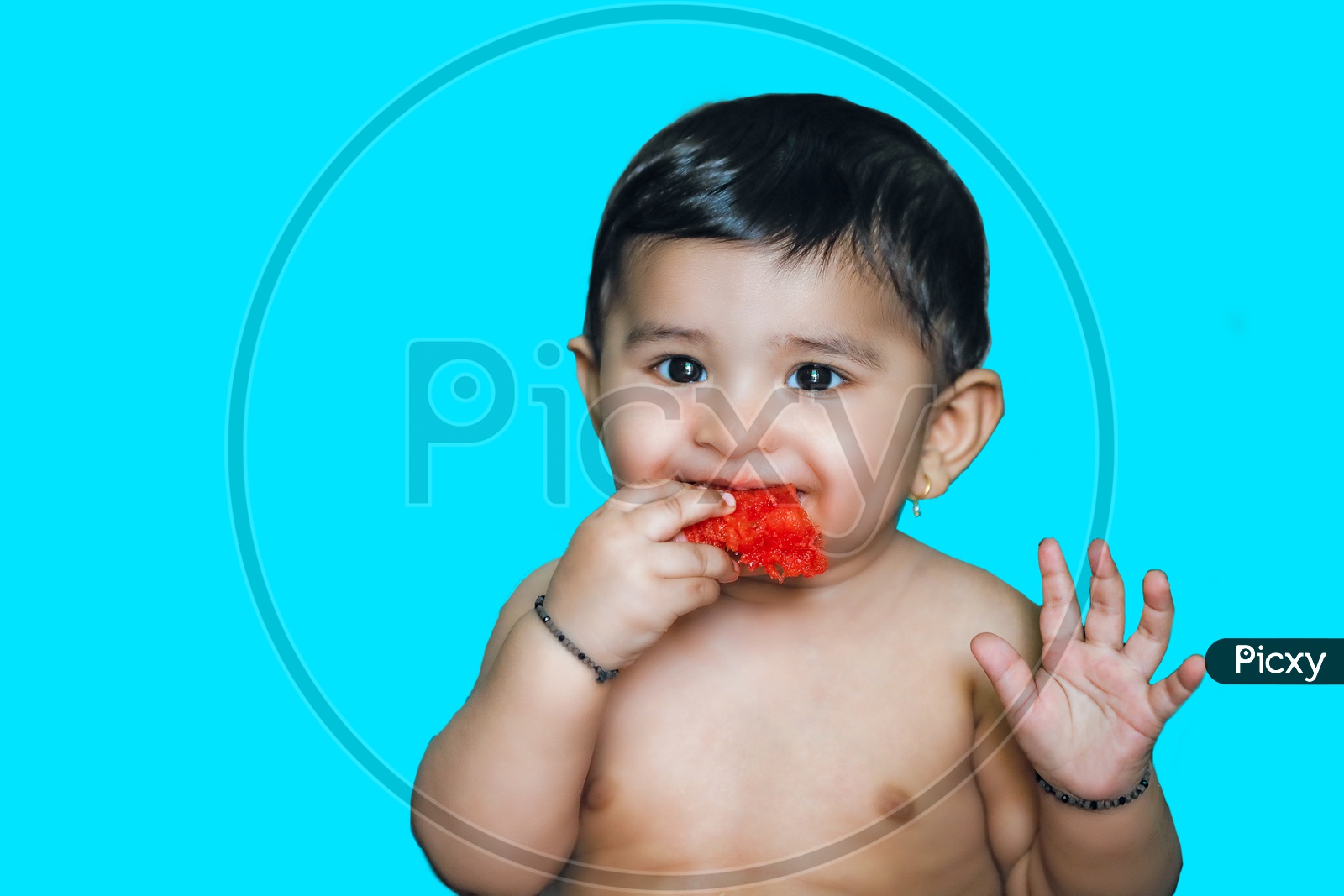 Indian baby Boy With Smiling Face Closeup Shot eating watermelon fruit
