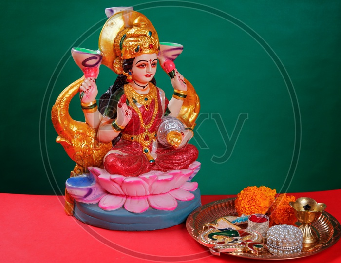 Sri Lakshmi Devi Idol with green background