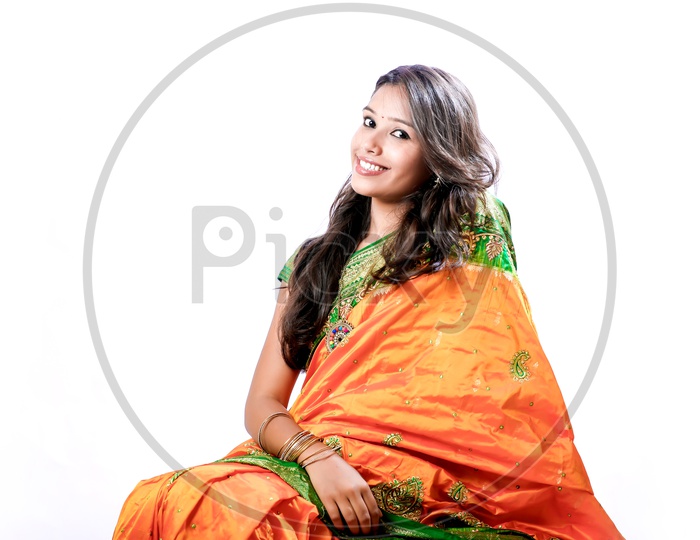 Indian Young Lady wearing a Saree with a Smiling Face on an Isolated White Background