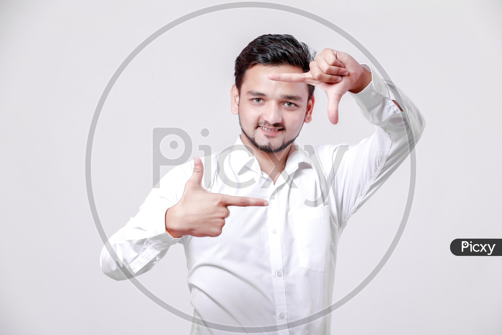 Indian Young Professional Man With a Smiling Face and With Gestures   On an Isolated White Background