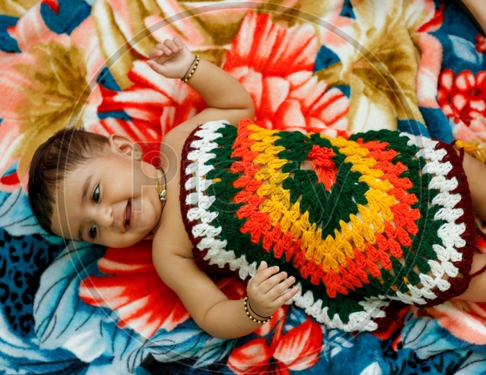 Indian Cute Baby Girl Lying on Bed Closeup Shot With Cute Expressions On Face