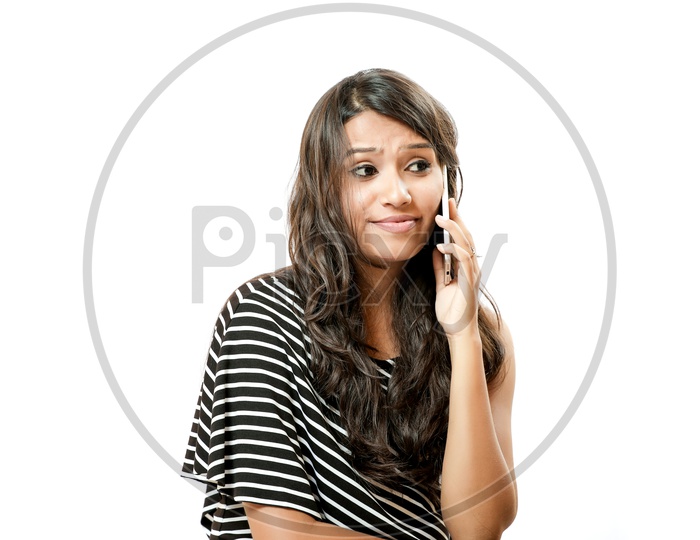 Indian Young Girl Talking in  Phone With a Smiling Face and Expression
