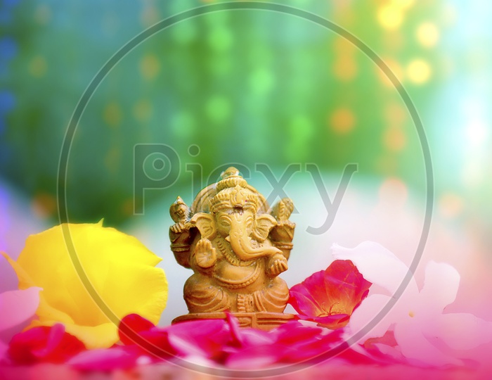 Beautiful photograph of Ganesh Idol with greenery in the background / Lord Ganesha