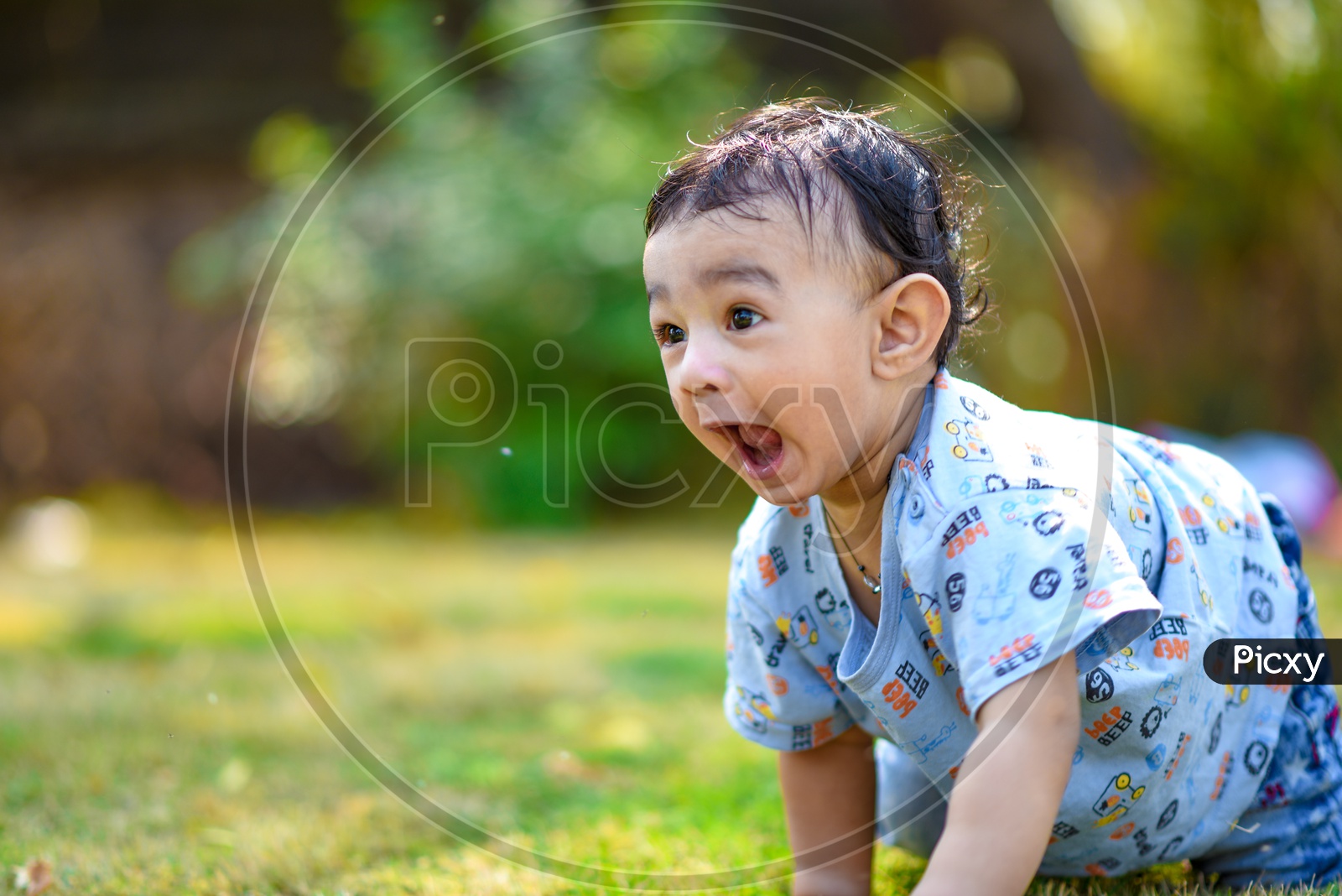 Indian Cute Baby Boy Playing With a Smiling Face Closeup Shot