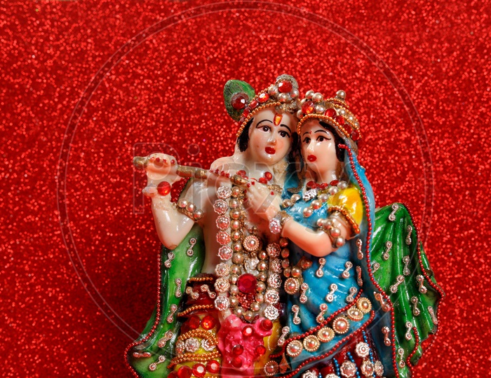 Radha Krishna Idol and beautiful red background / Lord Sri Krishna Idol